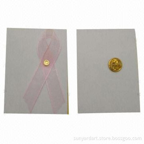 Cancer awareness ribbon bow with butterfly safety pin
